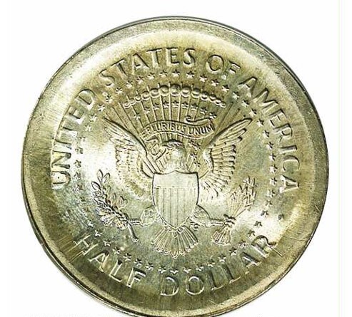 2012 Kennedy half dollar broadstrike error showing enlarged diameter, missing reeded edge, and flattened rim detail